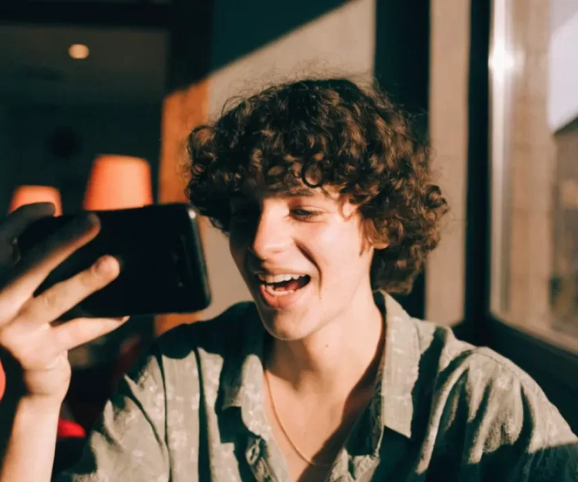Content creator recording a TikTok voice comment on a smartphone