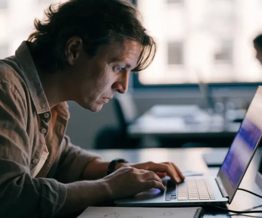 Web developer testing a WordPress 7.1 site update on a laptop before release